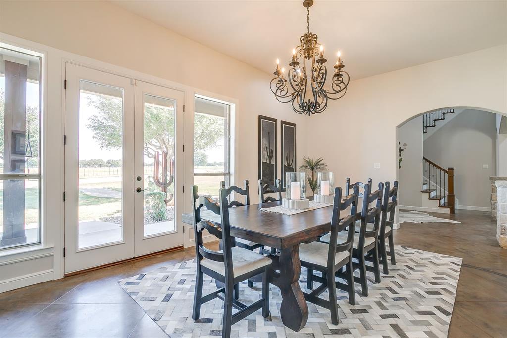 4991 Old Millsap Road Millsap, TX 76066 - Photo 11 of 40 a view of a dining room with furniture window and wooden floor