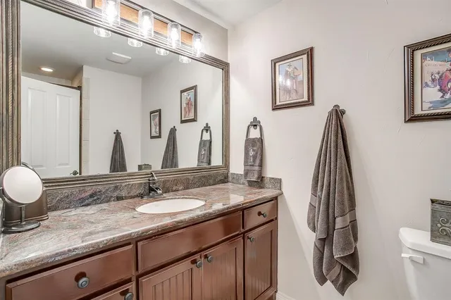 a bathroom with a sink double vanity and a mirror