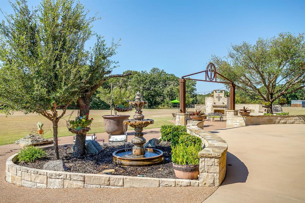 4991 Old Millsap Road Millsap, TX 76066 - Photo 28 of 40 a view of a house with backyard and sitting area