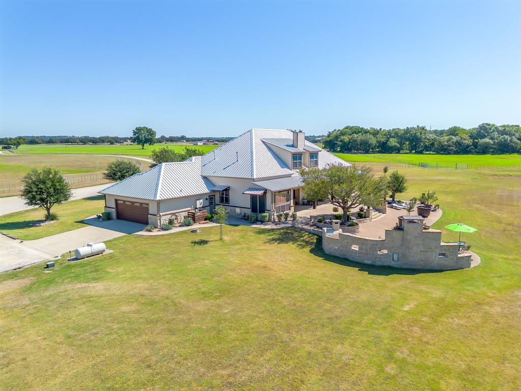 4991 Old Millsap Road Millsap, TX 76066 - Photo 30 of 40 a view of a lake with a table and chairs under an umbrella