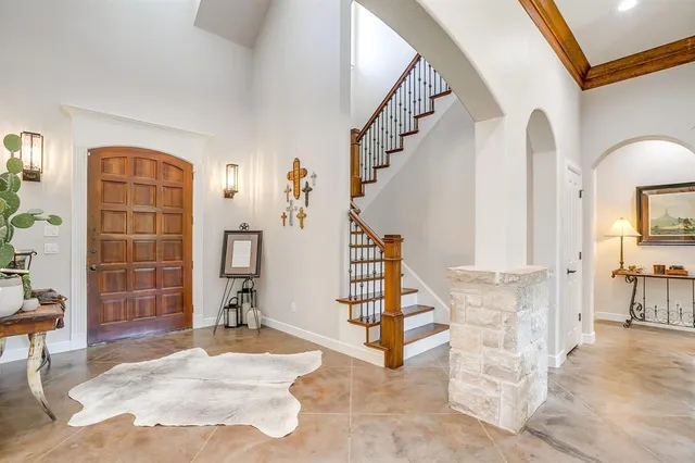 a view of entryway with furniture and wooden floor