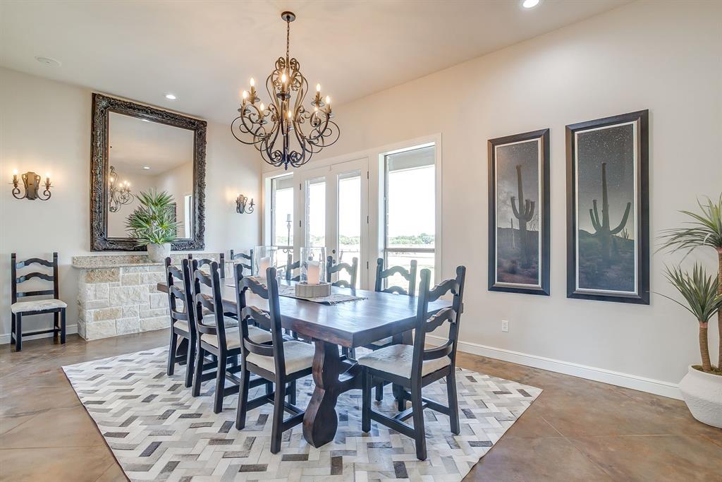 4991 Old Millsap Road Millsap, TX 76066 - Photo 10 of 40 a view of a dining room with furniture window and wooden floor