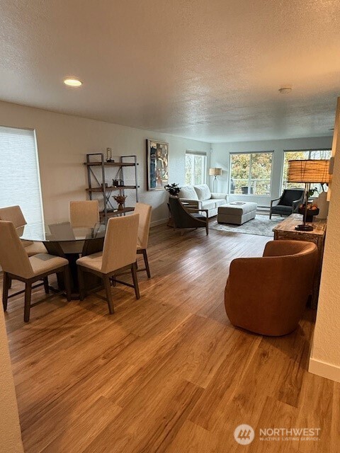 1311 12th Avenue South, Unit D301 Seattle, WA 98144 - Photo 3 of 12 a living room with furniture and a wooden floor