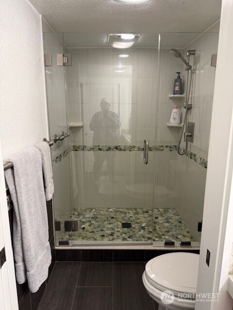 1311 12th Avenue South, Unit D301 Seattle, WA 98144 - Photo 5 of 12 a bathroom with a sink a toilet and shower