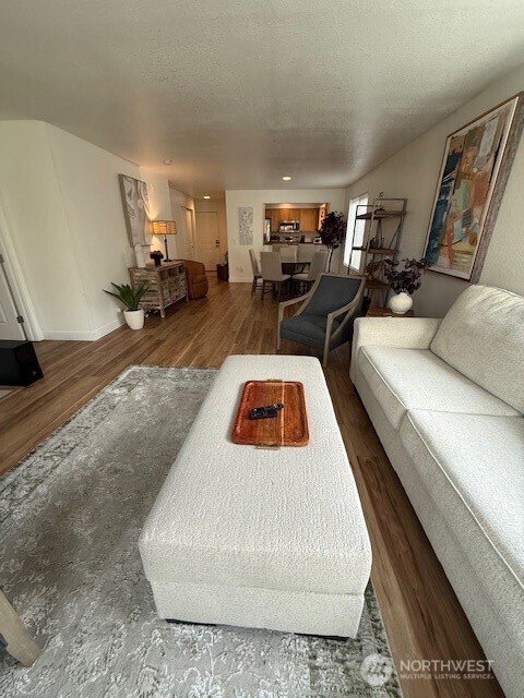 1311 12th Avenue South, Unit D301 Seattle, WA 98144 - Photo 7 of 12 a living room with furniture and a couch