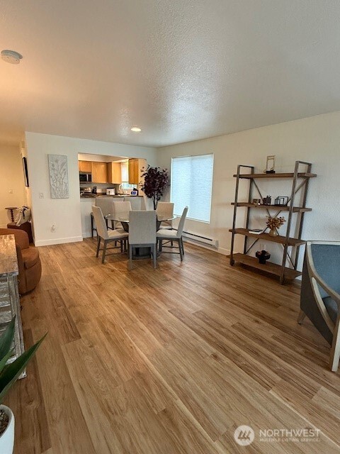 1311 12th Avenue South, Unit D301 Seattle, WA 98144 - Photo 9 of 12 a living room with furniture and a wooden floor
