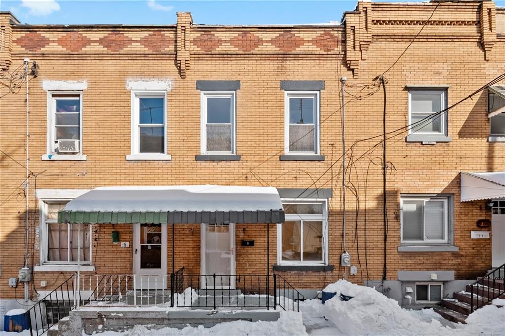 a front view of a building with a street