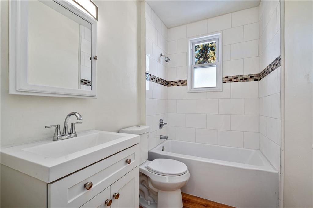 8 Edith Place Pittsburgh, PA 15213 - Photo 14 of 24 a bathroom with a sink a toilet and a bathtub