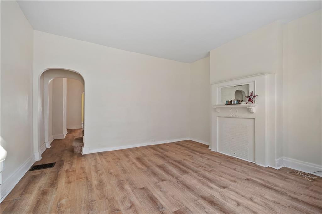 8 Edith Place Pittsburgh, PA 15213 - Photo 3 of 24 a view of empty room with wooden floor