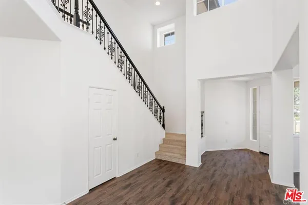 a view of entryway with wooden floor