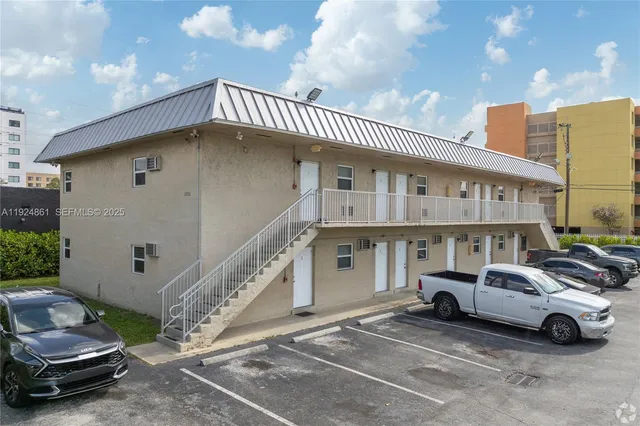 a view of a cars park in front of house