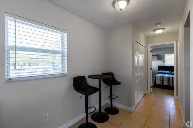 a view of a livingroom with furniture and windows