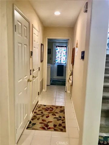 a bathroom with a sink a toilet a window and shower