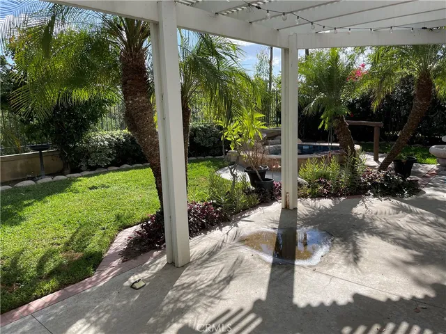 front view of a house with a flower garden