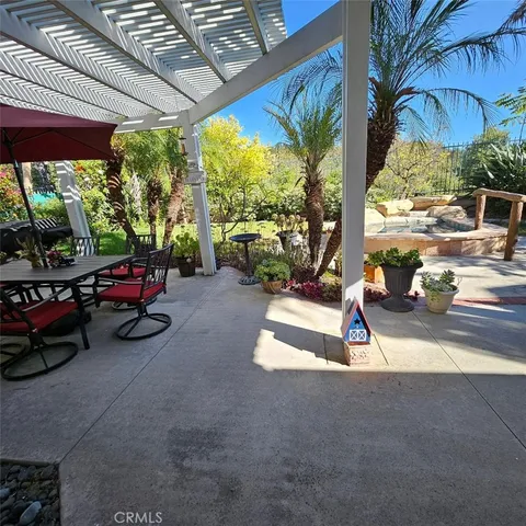 a view of a porch with furniture and a porch