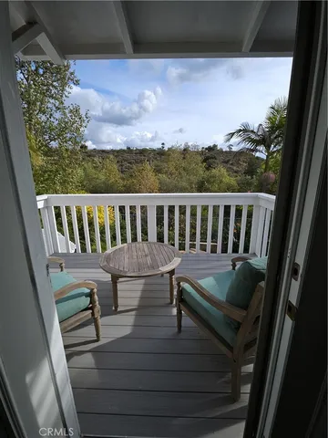 a view of balcony with furniture
