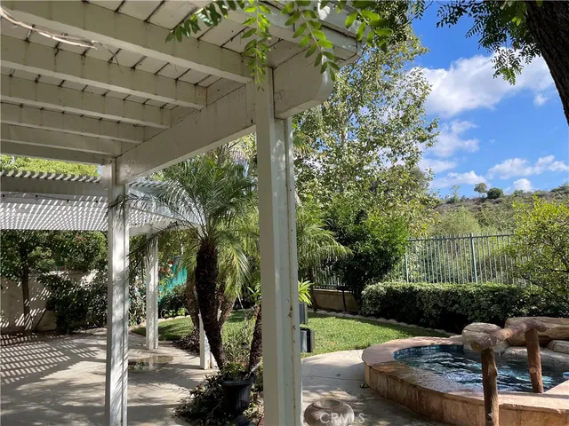 a view of backyard with patio