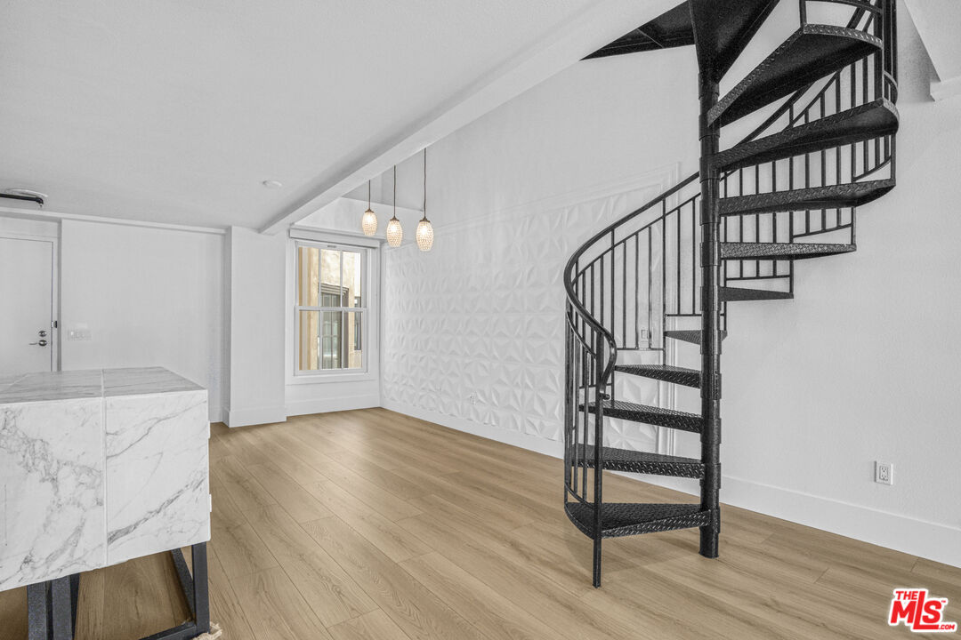 253 South Broadway, Unit 507 Los Angeles, CA 90012 - Photo 13 of 33 a view of an entryway with wooden floor and door