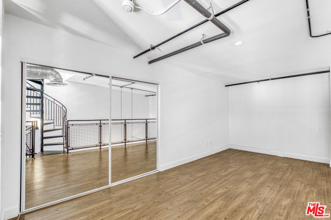 253 South Broadway, Unit 507 Los Angeles, CA 90012 - Photo 15 of 33 a view of empty room with wooden floor and white walls