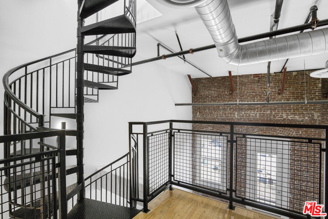 253 South Broadway, Unit 507 Los Angeles, CA 90012 - Photo 22 of 33 a view of staircase with railing and white walls
