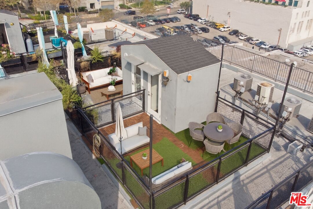 253 South Broadway, Unit 507 Los Angeles, CA 90012 - Photo 23 of 33 an aerial view of a house with roof deck and furniture