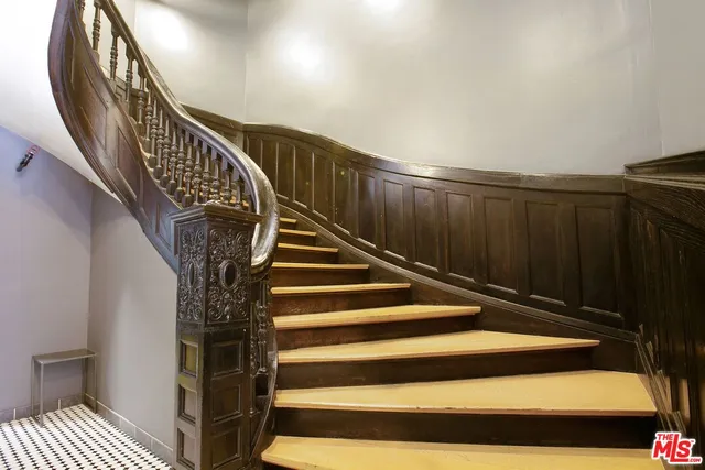a view of a patio with a table and chairs