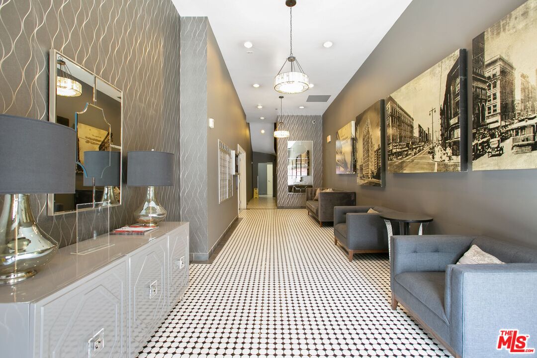 253 South Broadway, Unit 507 Los Angeles, CA 90012 - Photo 31 of 33 a large bathroom with a large mirror vanity and toilet