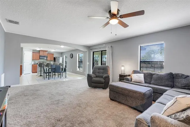 a living room with furniture and a table