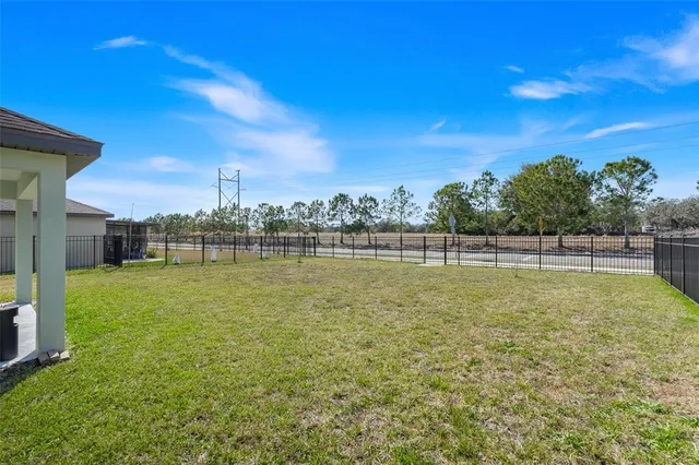 an aerial view of a house with a swimming pool