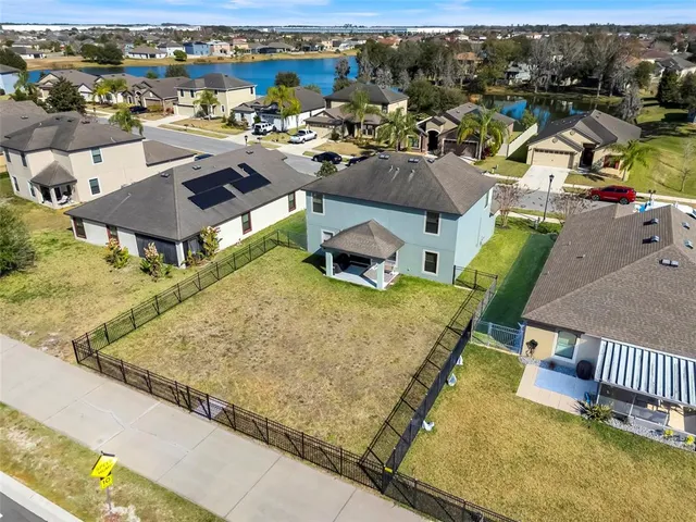 an aerial view of a residential building with outdoor space