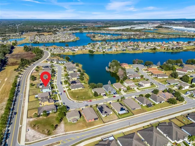 a aerial view of a house with a lake view