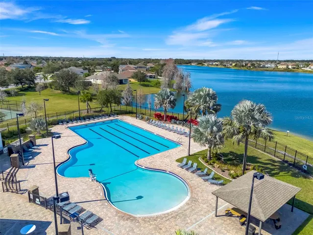 a view of a swimming pool with a lake view