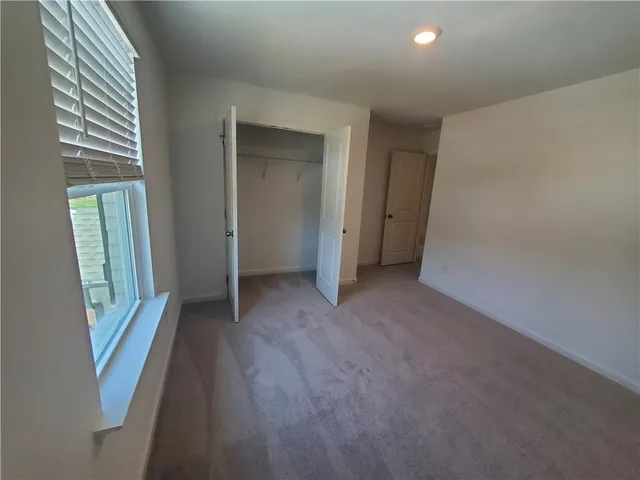 a view of hallway with windows