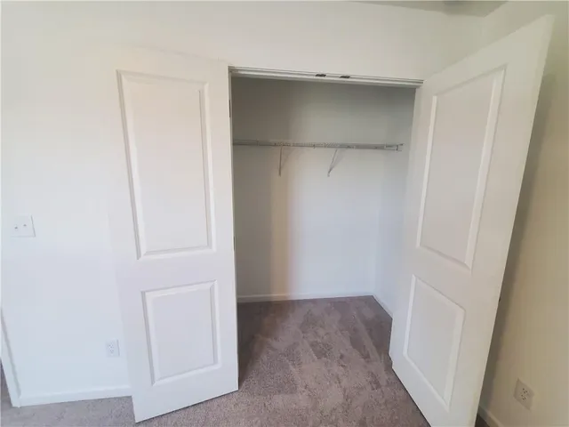 a view of an empty walk in closet