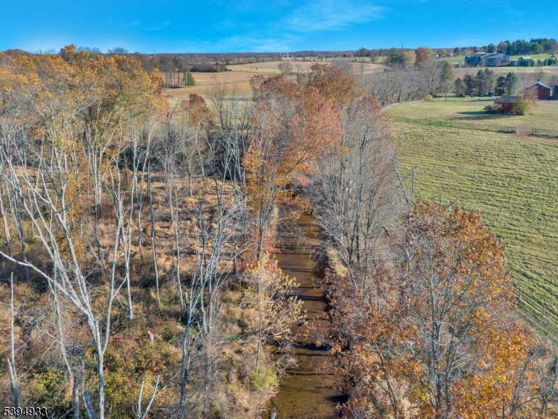 58 Dunkard Church Road Stockton, NJ 08559 - Photo 17 of 26 a view of a dry yard with wooden fence