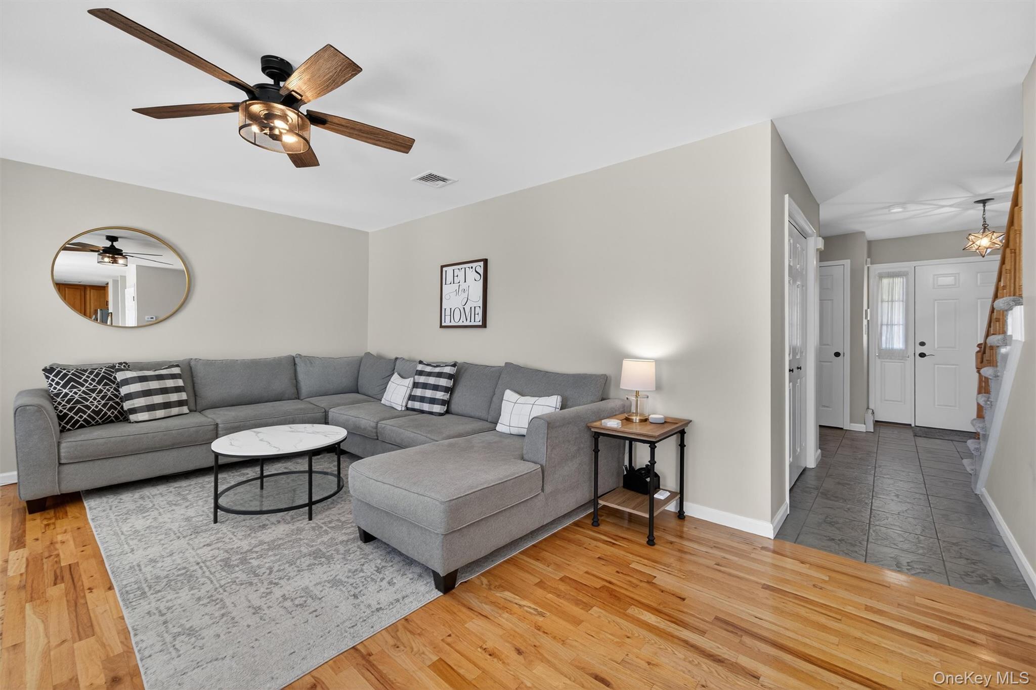 127 Egbertson Road Campbell Hall, NY 10916 - Photo 16 of 48 a living room with furniture and a wooden floor