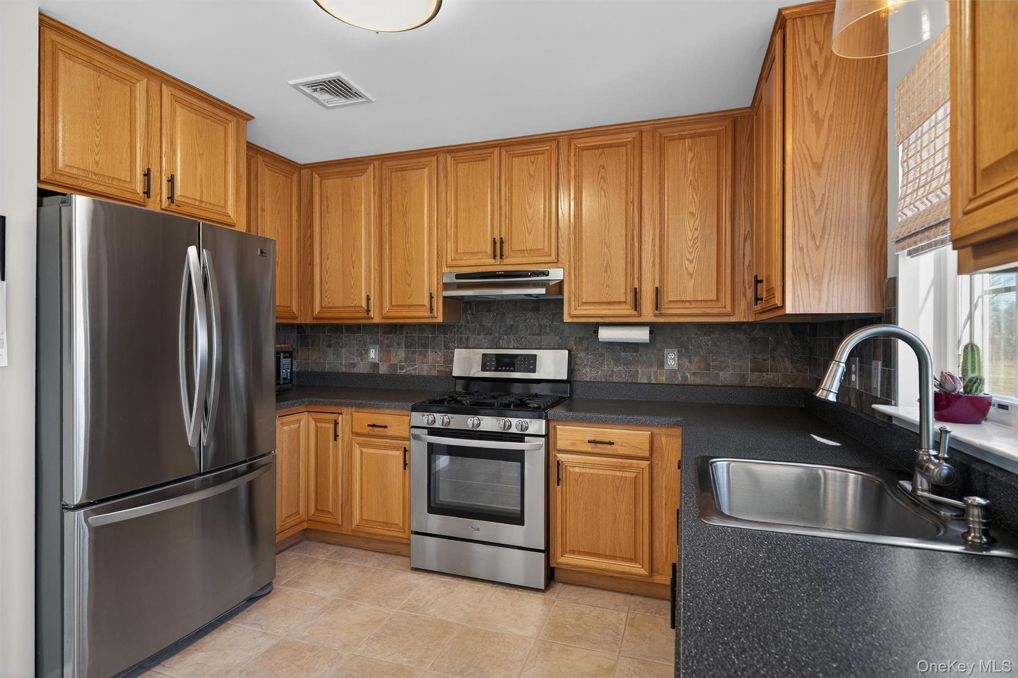 127 Egbertson Road Campbell Hall, NY 10916 - Photo 21 of 48 a kitchen with stainless steel appliances granite countertop a refrigerator stove and sink