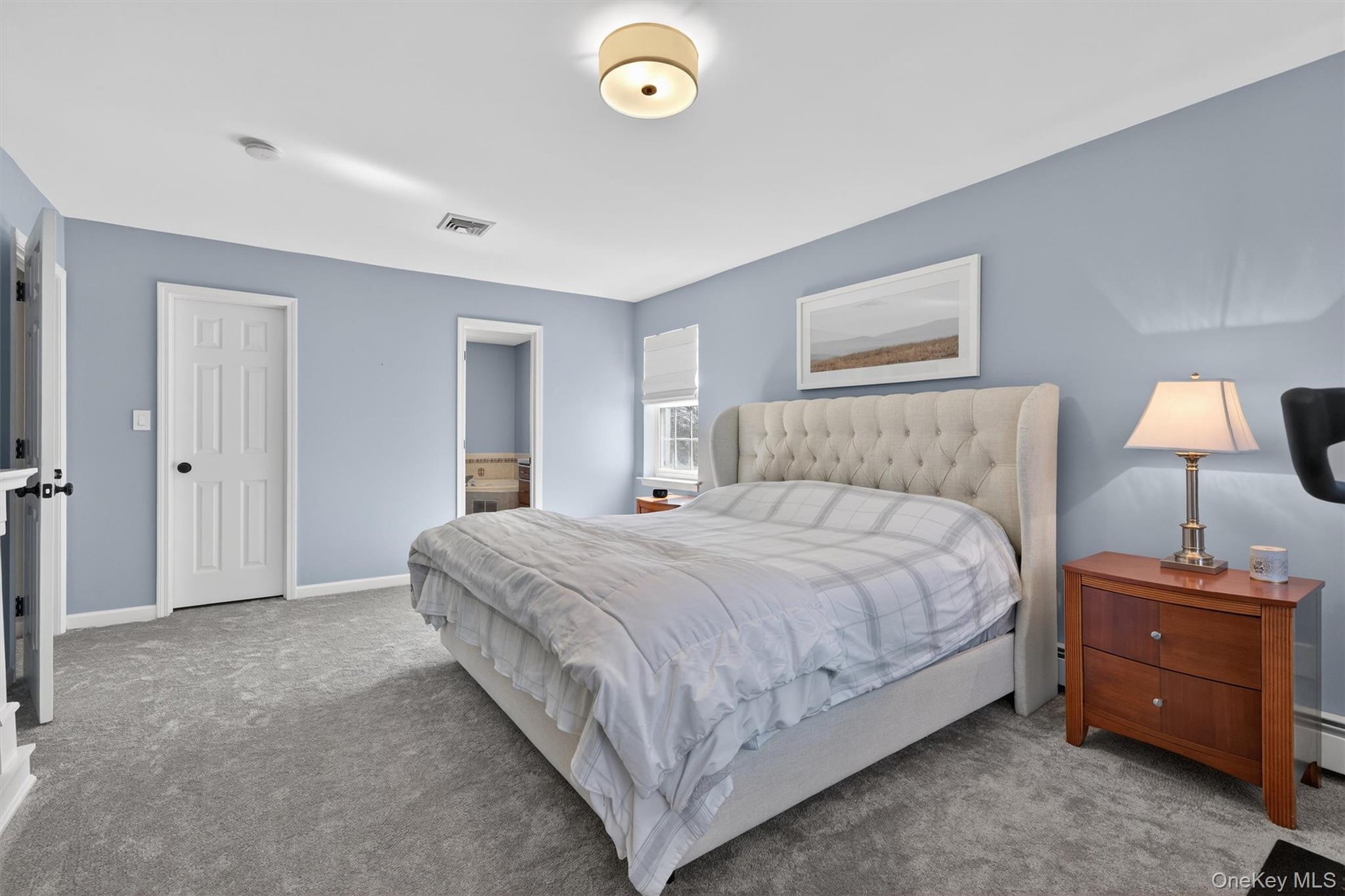 127 Egbertson Road Campbell Hall, NY 10916 - Photo 26 of 48 a bedroom with a bed and a lamp