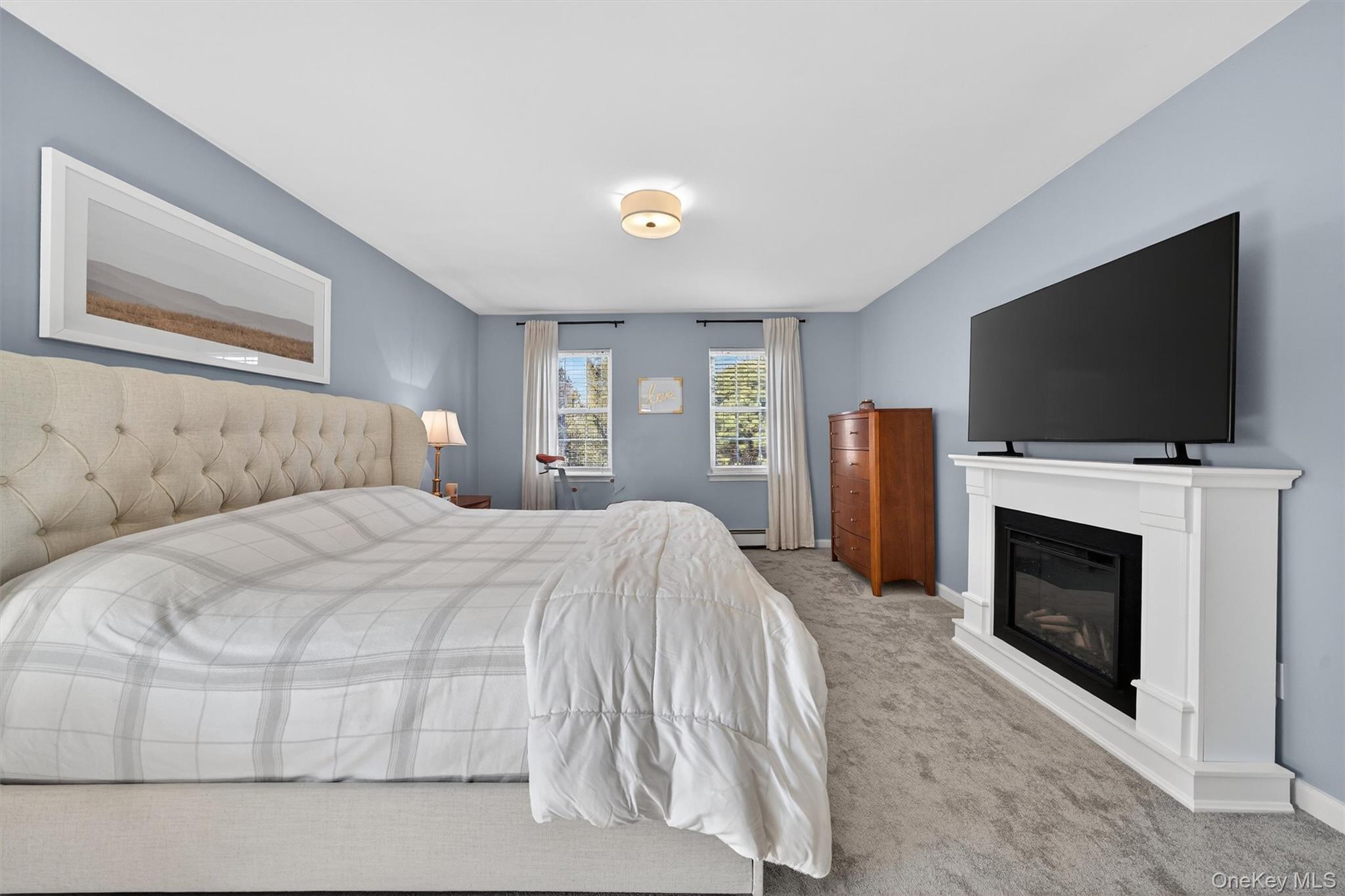 127 Egbertson Road Campbell Hall, NY 10916 - Photo 27 of 48 a spacious bedroom with a bed and a flat screen tv