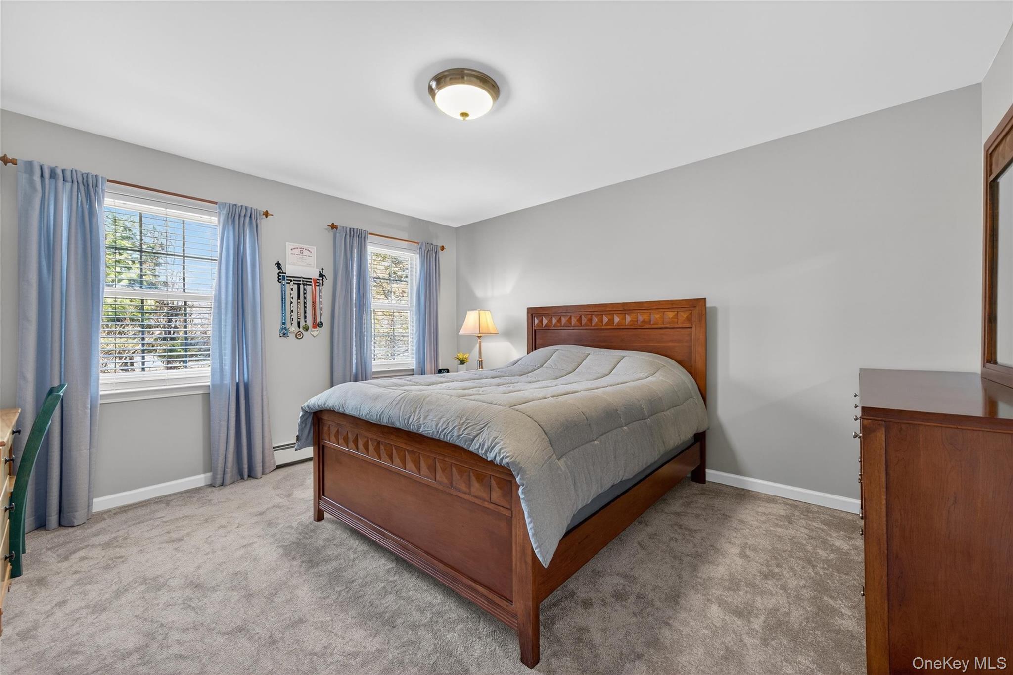127 Egbertson Road Campbell Hall, NY 10916 - Photo 30 of 48 a spacious bedroom with a bed and window