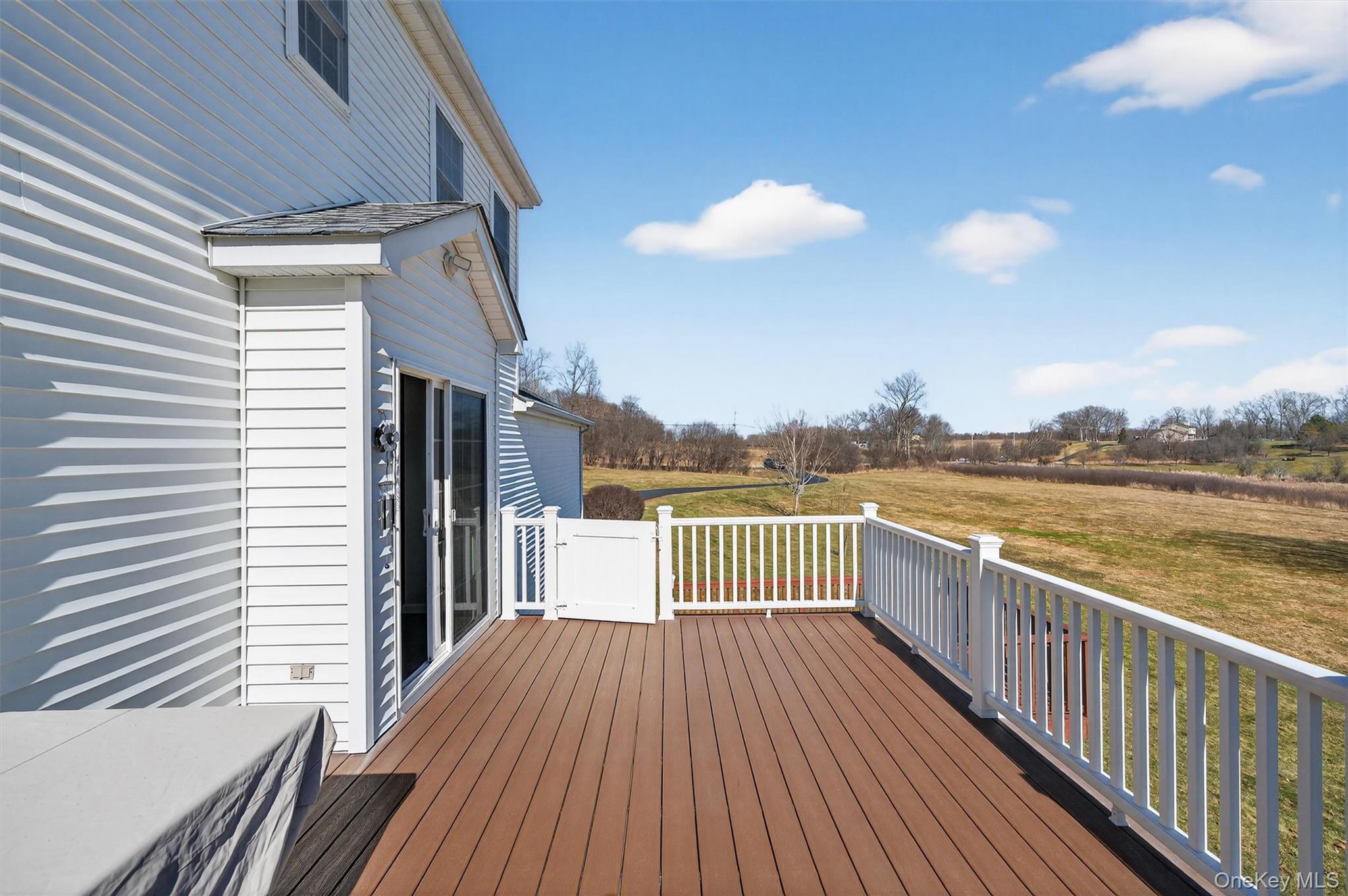 127 Egbertson Road Campbell Hall, NY 10916 - Photo 35 of 48 a view of a roof deck with wooden floor and fence