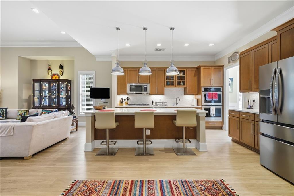 608 Red Leaf Way Canton, GA 30114 - Photo 18 of 43 a living room with stainless steel appliances kitchen island granite countertop furniture and a kitchen view