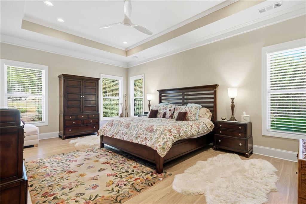 608 Red Leaf Way Canton, GA 30114 - Photo 23 of 43 a bedroom with a bed and a couch