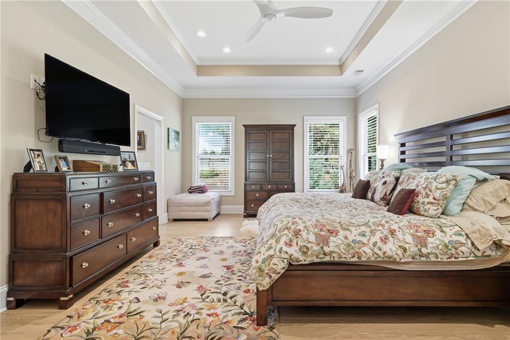 608 Red Leaf Way Canton, GA 30114 - Photo 24 of 43 a bedroom with a bed and a flat screen tv