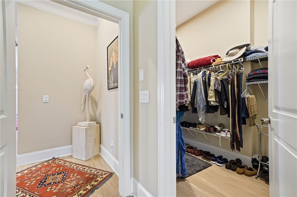 608 Red Leaf Way Canton, GA 30114 - Photo 28 of 43 a view of walk in closet with clothes and shoes
