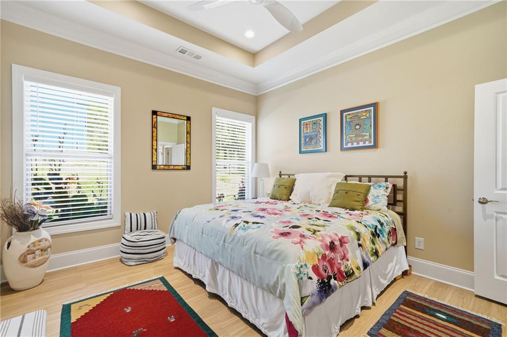 608 Red Leaf Way Canton, GA 30114 - Photo 31 of 43 a bedroom with a bed and a dresser next to a window