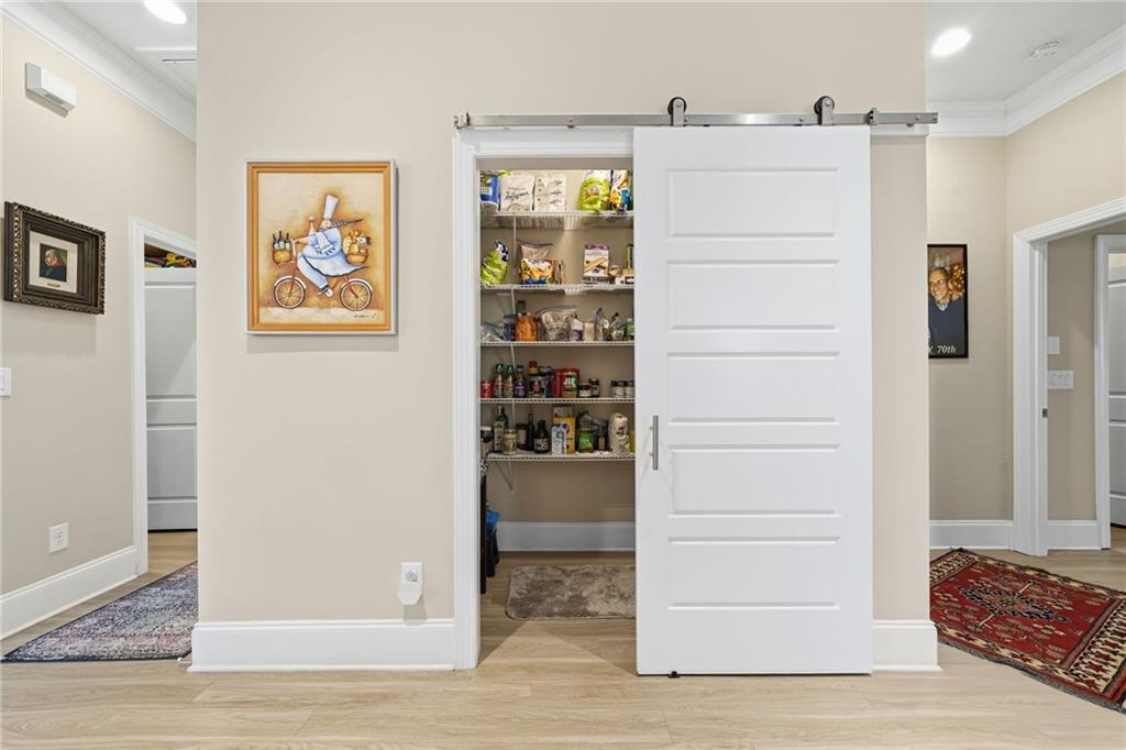 608 Red Leaf Way Canton, GA 30114 - Photo 34 of 43 a view of walk in closet with living room