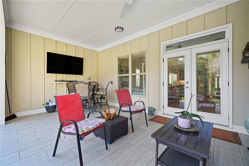 608 Red Leaf Way Canton, GA 30114 - Photo 40 of 43 a living room with furniture and a flat screen tv