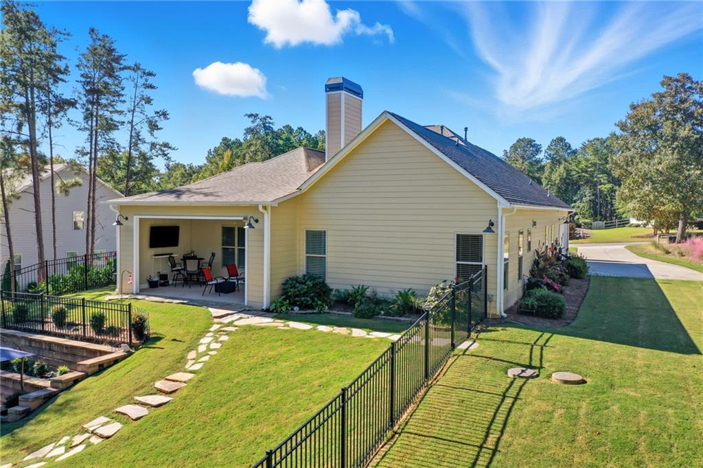 608 Red Leaf Way Canton, GA 30114 - Photo 5 of 43 a view of a house with pool and a yard