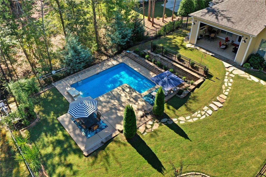 608 Red Leaf Way Canton, GA 30114 - Photo 6 of 43 an aerial view of a house with a garden and swimming pool